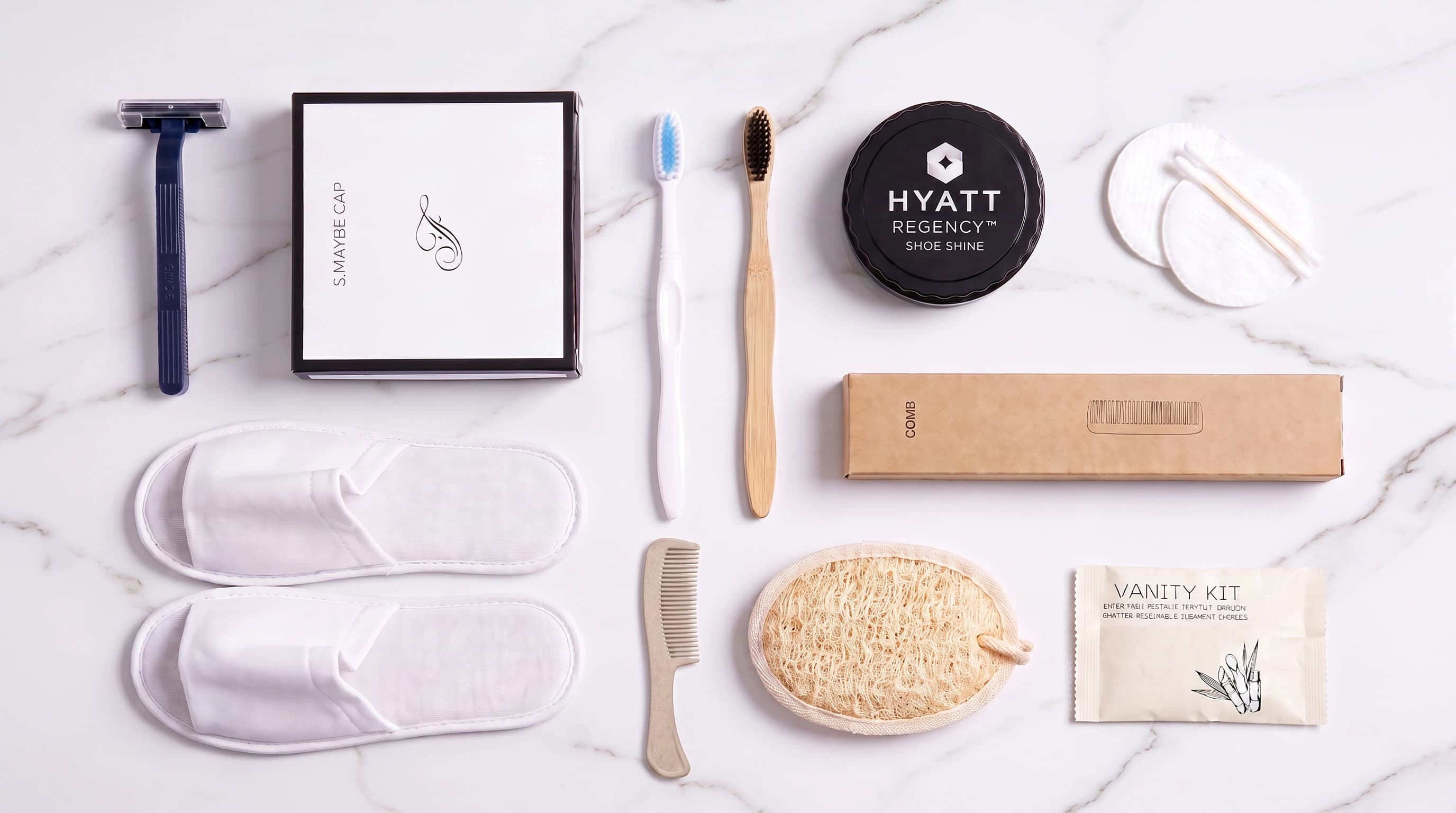 The same amenities set laid out flat on white marble